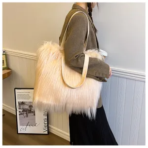 Detail showing the texture of the large fluffy faux fur tote bag on a shoulder
