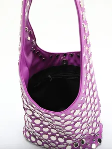 Interior detail of purple punk bucket bag with silver rivets and zipper pocket