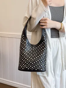 Punk style black bucket bag with silver stud embellishments for trendy women's fashion