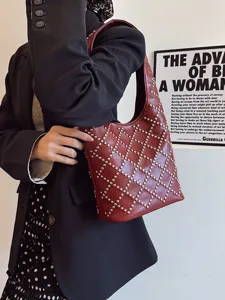 Punk style burgundy leather bucket bag with silver round rivets for women