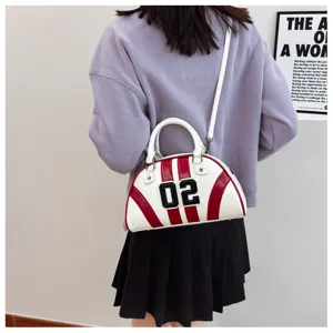 Detailed view of the stylish red and white bowling handbag with number 02 patch decoration