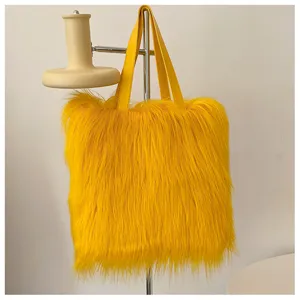 Detailed view of vibrant yellow long faux fur texture on a trendy fashion tote bag