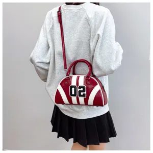 Stylish red and white bowling bag with "02" number patch and adjustable strap.