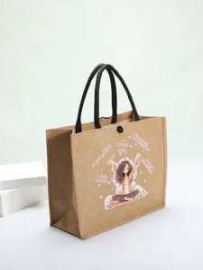 Close-up of eco-friendly jute tote bag featuring a stylish cartoon girl and text print