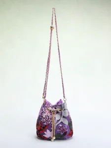 Detailed view of elegant purple bucket bag with floral embroidery and sequins