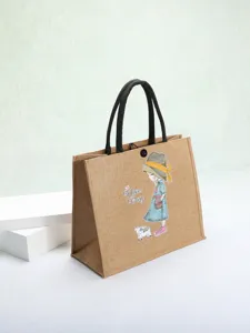 Detailed macro view of the eco-friendly jute bag with cartoon print and black handles