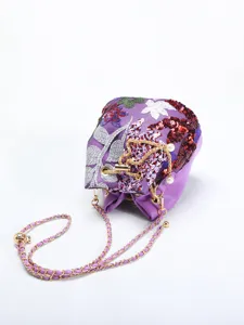 Detailed view of purple floral embroidery bucket bag with sequins and chain strap