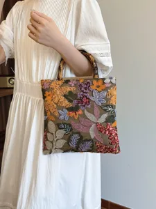 Vintage embroidered linen handbag with natural bamboo handle and colorful sequins for women