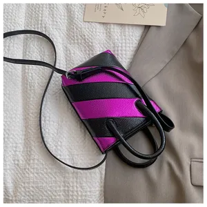 Close-up of mini bucket bag with metallic purple and black diagonal stripes