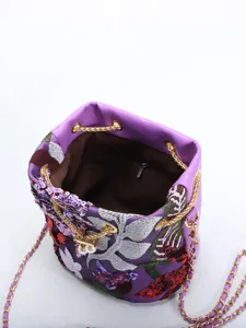 Macro detail of purple New Chinese style bucket bag with flower embroidery and sequin mesh