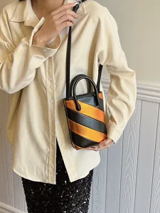 Women's trendy color-blocked PU leather mini bucket bag with orange and black stripes