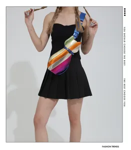 Metallic rainbow cat-shaped crossbody bag shown on model in a studio setting