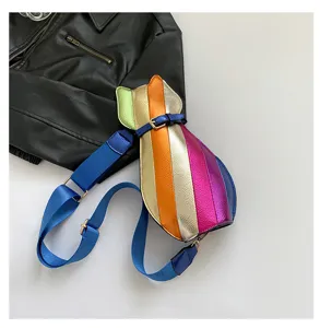 Colorful cat-shaped crossbody bag with vibrant metallic rainbow stripes and blue strap