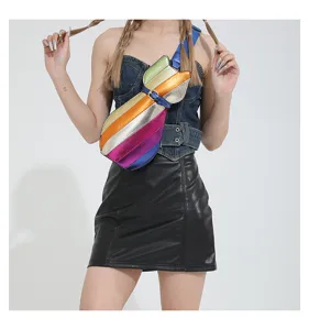 Vibrant rainbow cat-shaped crossbody bag worn by a model in a stylish urban outfit.