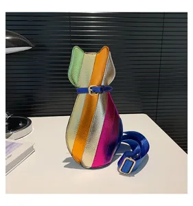 Side view of a cat-shaped crossbody bag with vibrant metallic rainbow stripes