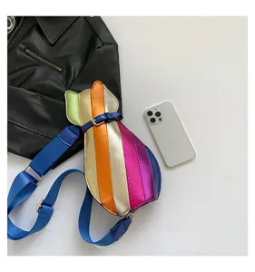 Cat-shaped crossbody bag with colorful metallic patchwork and blue strap detail