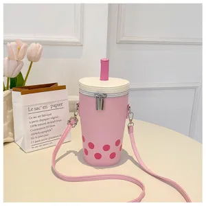 Detailed view of pink bubble tea cup shaped crossbody bag with straw and pearl dots