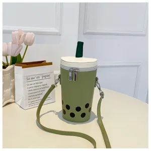 Detailed view of matcha green bubble tea shaped crossbody bag featuring unique straw design