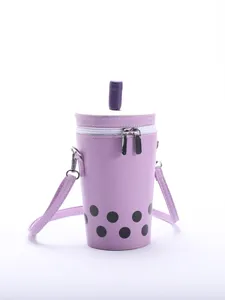 Detailed front view of a purple bubble tea cup shaped crossbody bag with pearl dots