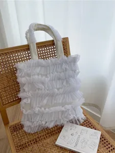 Elegant white ruffled tulle tote bag with a romantic fairy-style cake skirt design