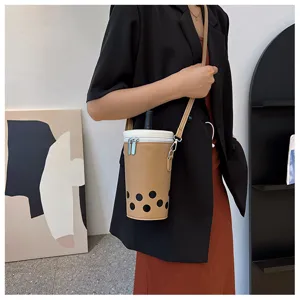 Detailed view of creative bubble tea shaped crossbody bag in tan color