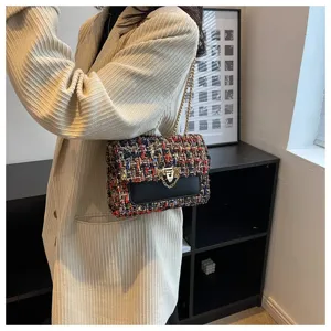 Elegant multi-color tweed chain shoulder bag paired with a stylish beige blazer