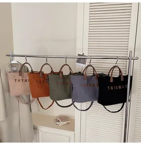 Corduroy tote bag with top handles, spacious casual shoulder bag for daily commute and style.