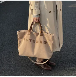 Detail shot of the casual corduroy tote bag with stylish letters and large capacity for daily use.