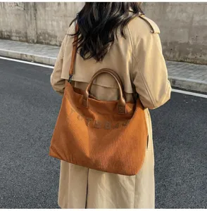 Detail view of the stylish brown corduroy tote bag, large capacity, casual handbag for women commute.