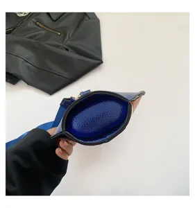 Macro detail showing the oval bottom of a blue and orange textured leather bag