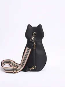 Back view of black cat-shaped crossbody chest bag with striped canvas strap