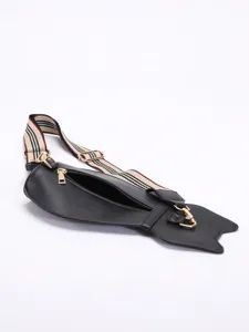 Cute cat-shaped black chest bag with stylish striped strap and gold-tone hardware