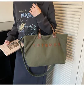 Casual corduroy tote bag with brown PU handles and shoulder strap, stylish daily commuter bag.