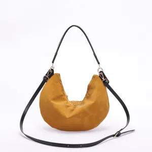 Vintage mustard yellow crescent hobo bag with trendy rivet studs and black shoulder straps
