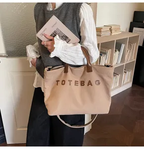 Casual corduroy tote bag for women, large capacity commuter handbag with letter design.