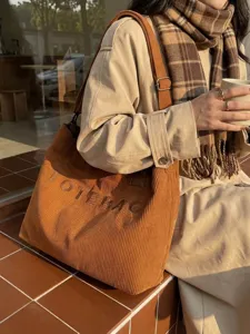 Stylish corduroy tote bag for women, large capacity casual shoulder bag for daily commuting.