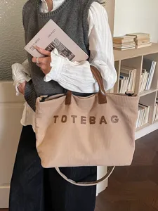 Casual corduroy tote bag for women, large capacity shoulder bag with handles and stylish design.