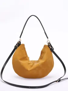 Stylish mustard yellow crescent moon hobo bag with gold rivets and dual black straps