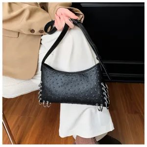 Black punk style shoulder bag with metal rings, niche design underarm bag for women details.