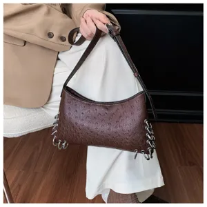 Brown ostrich texture shoulder bag with metal rings, niche punk style underarm bag for women.