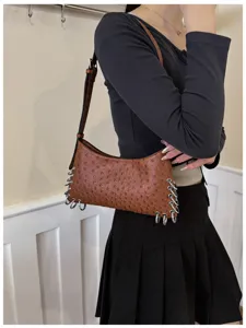 Punk style brown shoulder bag with metal rings, trendy underarm bag for women detail view
