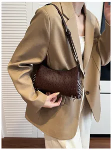 Brown ostrich pattern shoulder bag for women, chic metal rings and cool punk design.