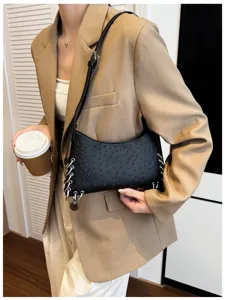 Black leather shoulder bag for women with metal ring chain, punk style trendy design