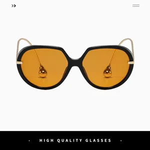 Lunettes de soleil ovales surdimensionnées pour femmes avec verres orange et monture noire