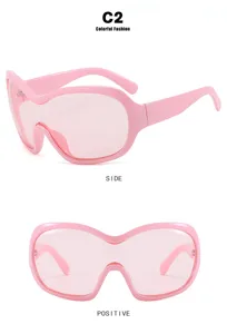 Multi-angle display of pink oversized Y2K shield sunglasses in futuristic punk style
