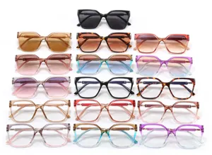 Macro view showing a variety of retro cat-eye sunglasses in multiple frame colors and gradients