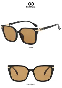 Detailed view of square black sunglasses with gold temples and brown lenses