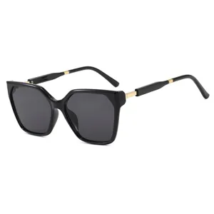 Oversized retro cat-eye sunglasses for women with black frame and gold temple details