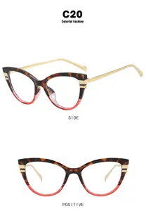 Lunettes oeil de chat avec monture dégradé écaille rouge et branches en métal doré