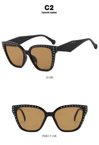 Detail view of cat-eye glasses frame with rivets and anti-blue light lenses